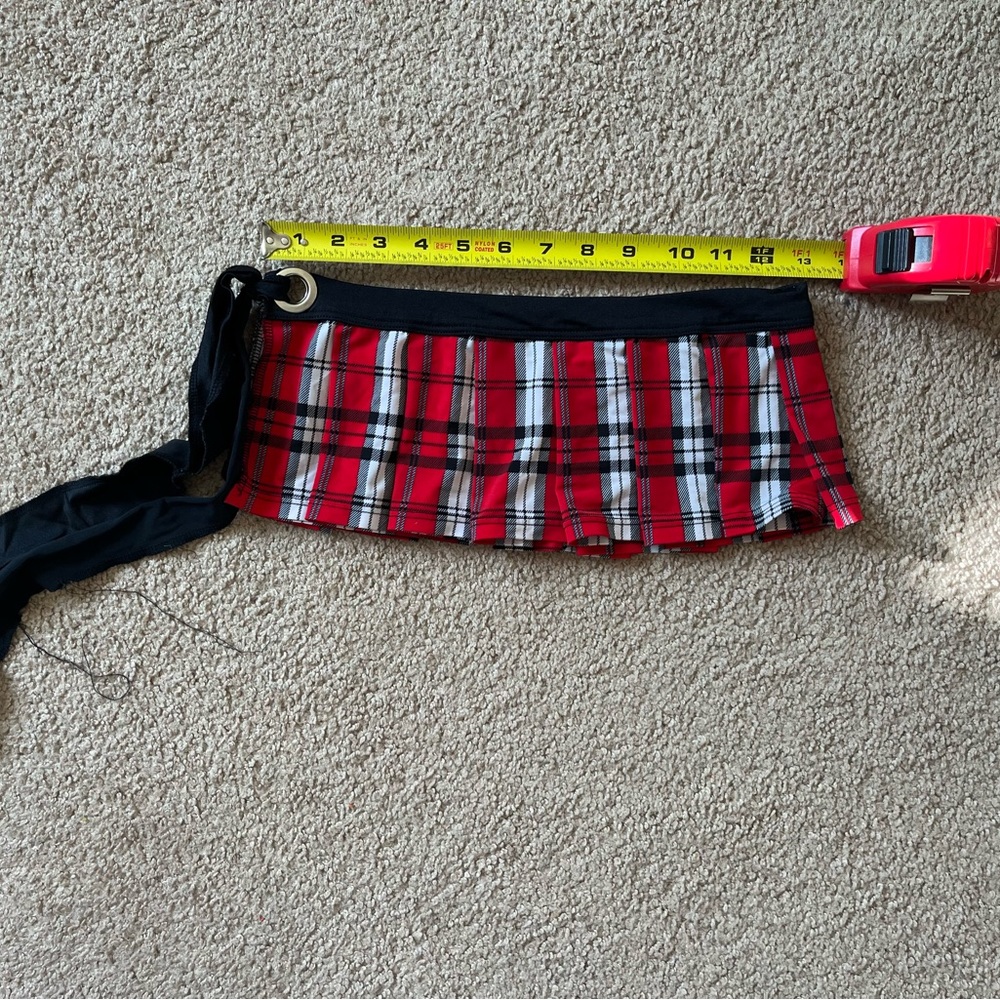 Schoolgirl skirt. Ties on side, can be adjusted.